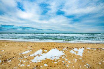 Snow-covered landscape at Chesapeake Bay, Virginia Beach, creating a serene winter scene
