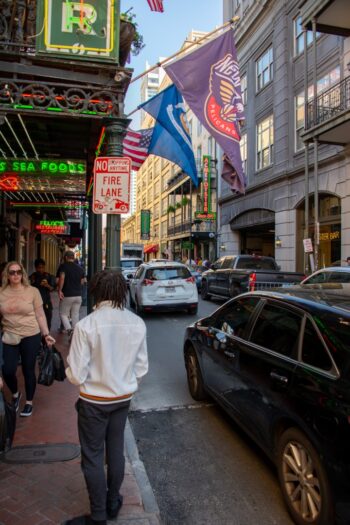 Colorful buildings and street scenes along Iberville Street in New Orleans, capturing the vibrant atmosphere of the city
