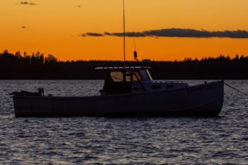 Lobster boat moored in Pond Cove, Roque Bluffs, Maine, during October 2025