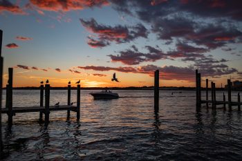 Sunset at Dockside at Virginia Beach, casting warm colors across the sky and water