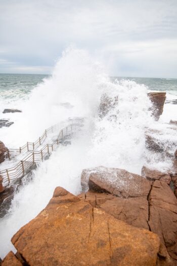 Waves crashing against rocky cliffs at Thunder Hole in Acadia National Park, Maine, during October 2025