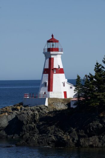 Head Harbour Lightstation on Campobello Island, New Brunswick, surrounded by ocean and rocky coastline. Established 1829